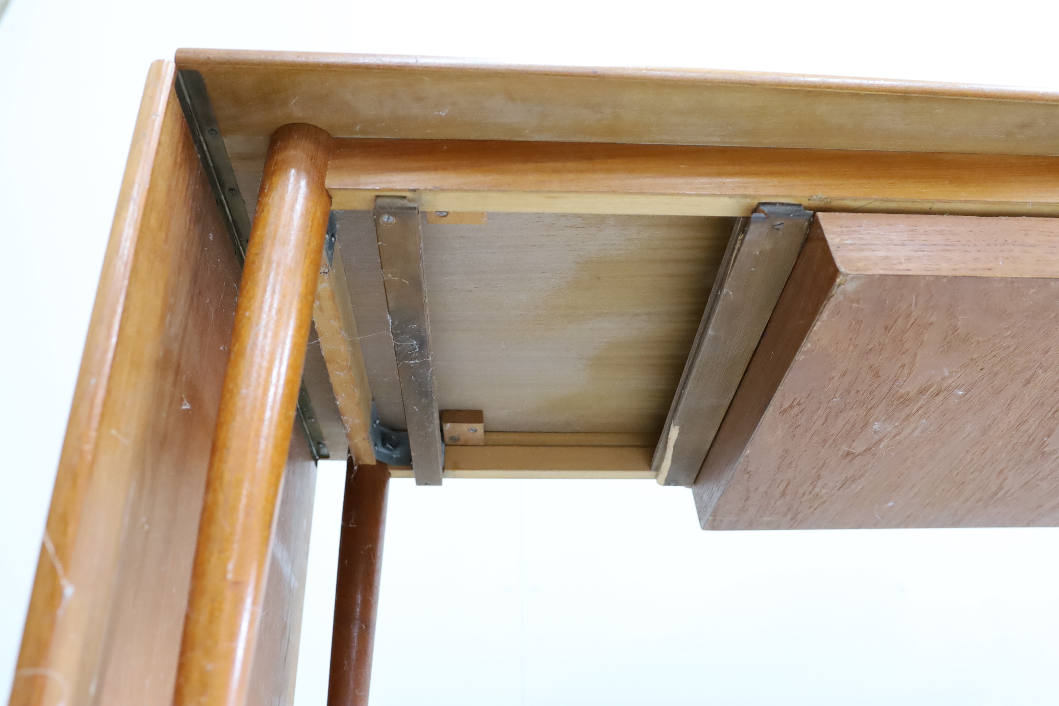 A mid century Danish design rectangular teak drop flap coffee / work table, width 117cm, depth 54cm, height 51cm (drawer runners in need of repair)